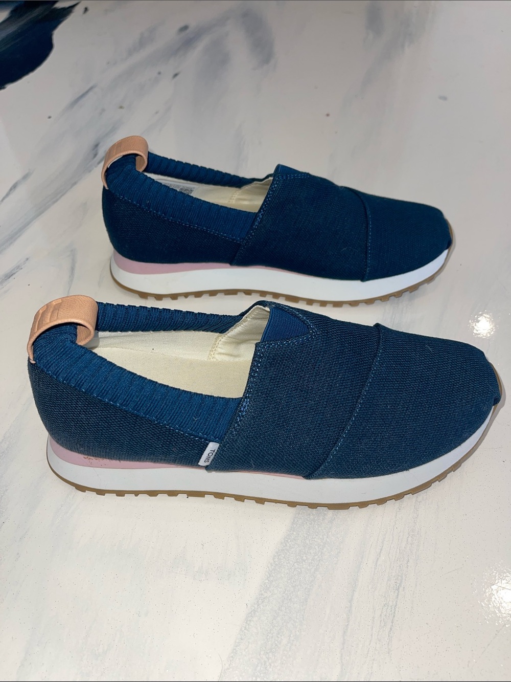 Toms Navy Slip-Ons with Pink and Tan Heel Details